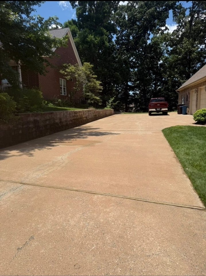 Bright clean driveway after pressure washing